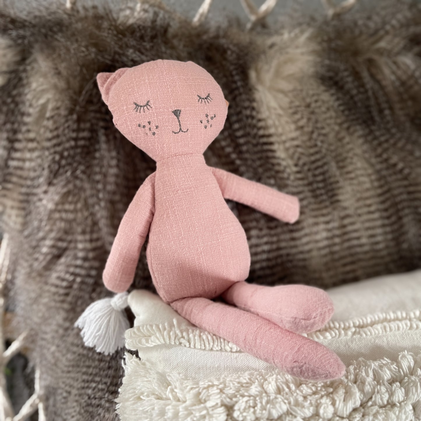 Rose coloured cat toy.
