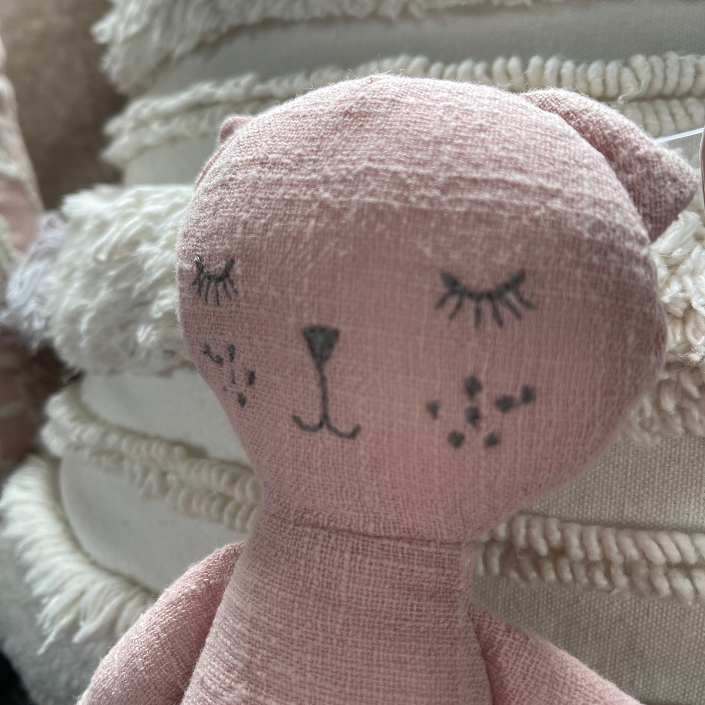 Rose coloured cat toy.