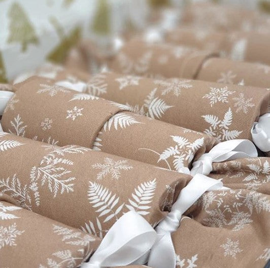 Reusable Christmas Crackers in beige with white snowflake print.