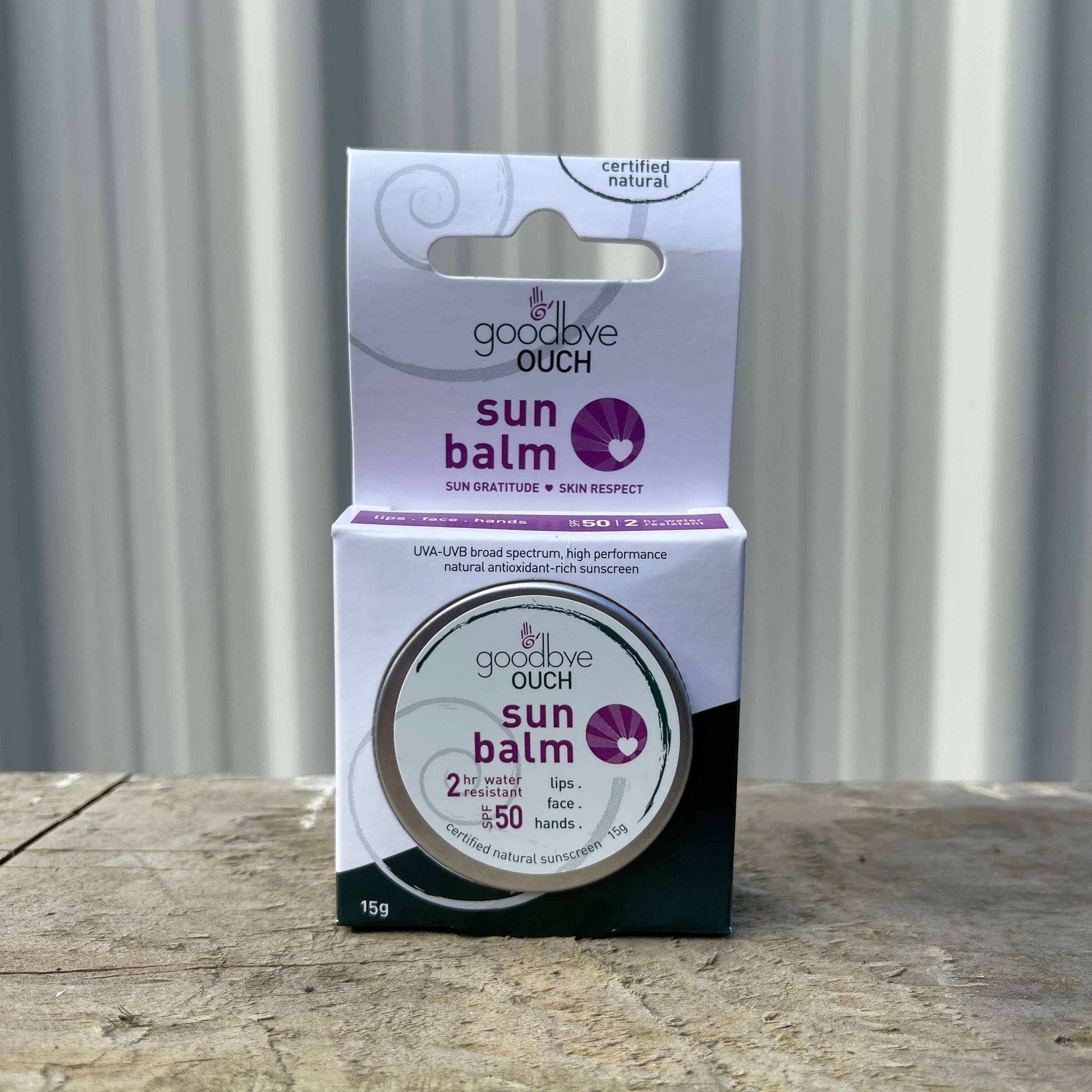 Small tin of Sun Balm by Goodbye Ouch.