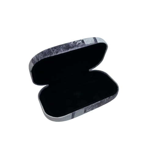 Small trinket case opened with black lining.