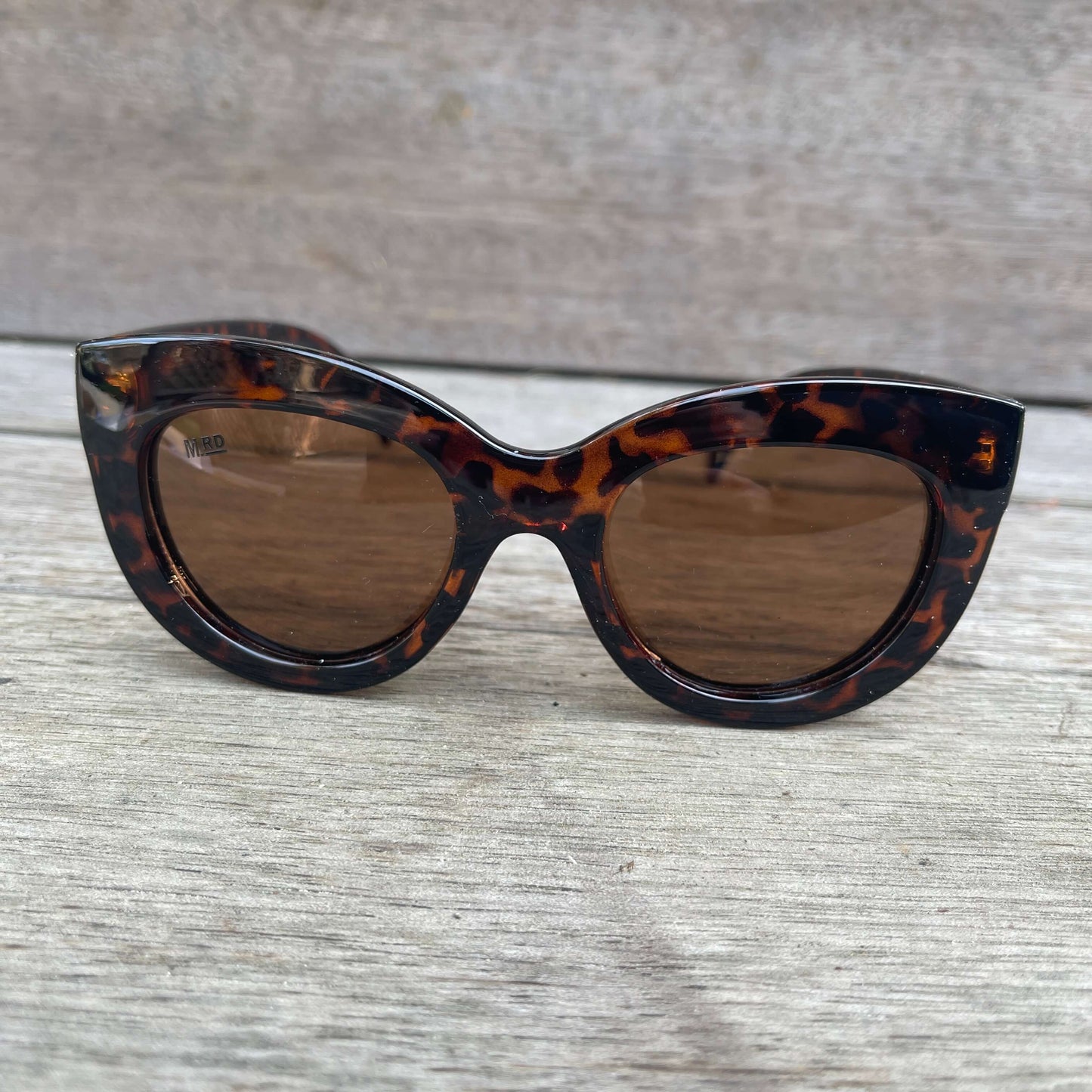 Womens sunglasses with Elizabeth Taylor style frames in tortoiseshell.