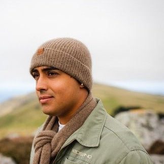 Man wearing brown woolen knit beanie.