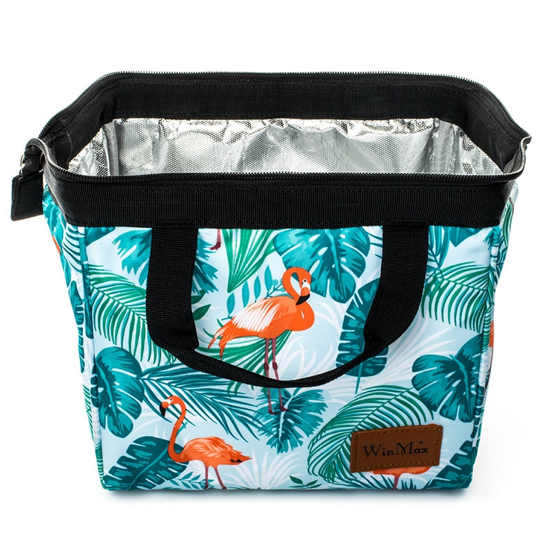 Winmax cooler bag in white with minty green tropical foliage and pink flamingo print.