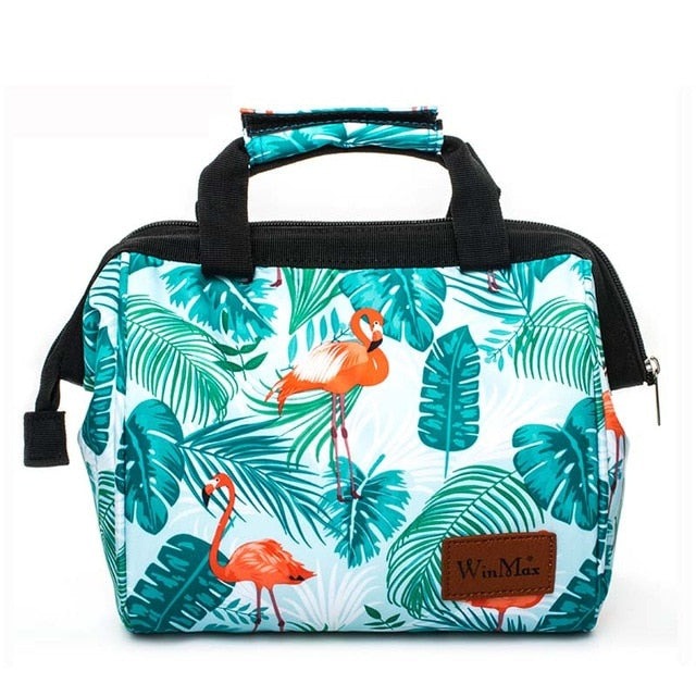 Winmax cooler bag in white with minty green tropical foliage and pink flamingo print.