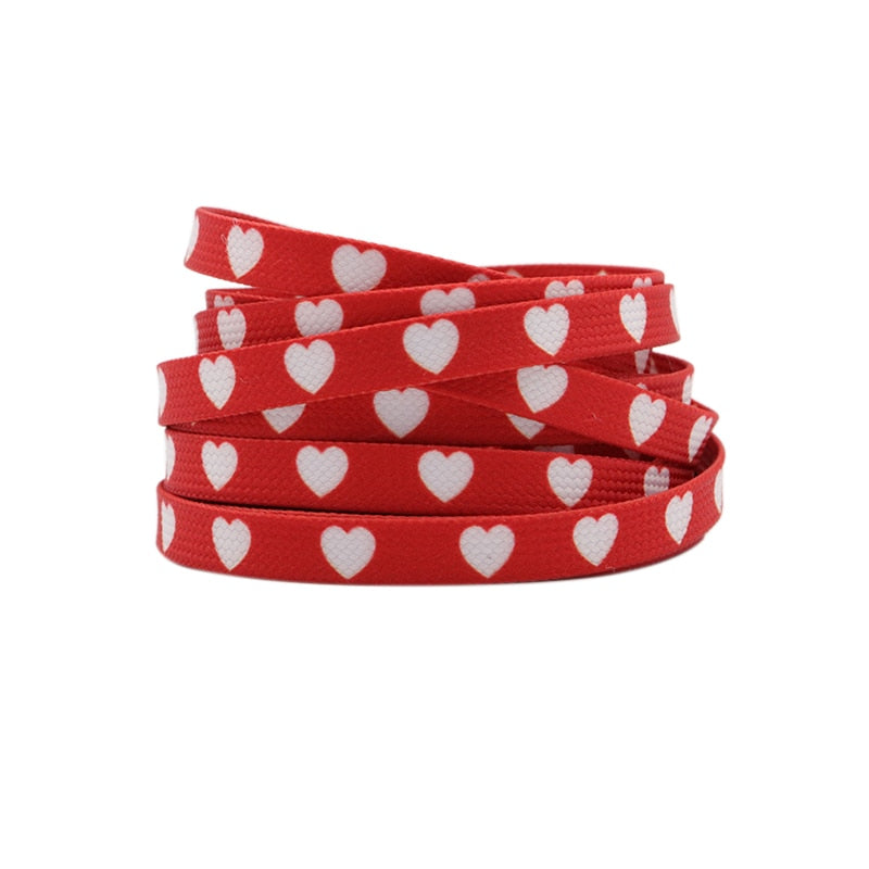Red shoelaces with white hearts.