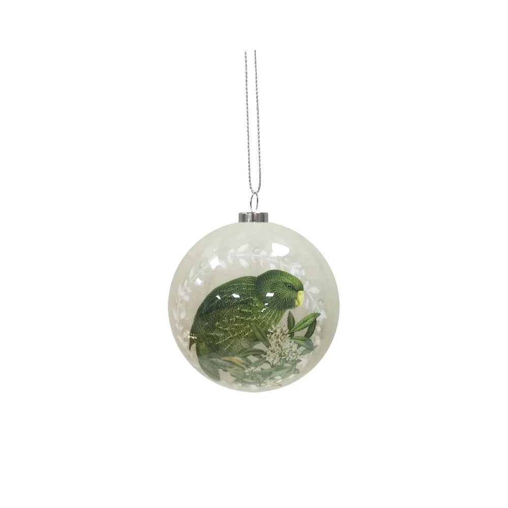 Light grey Christmas bauble featuring a Kea bird on native NZ flowers.