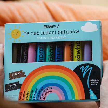 Box of Moana RD te reo Máori rainbow colour markers held by a person.