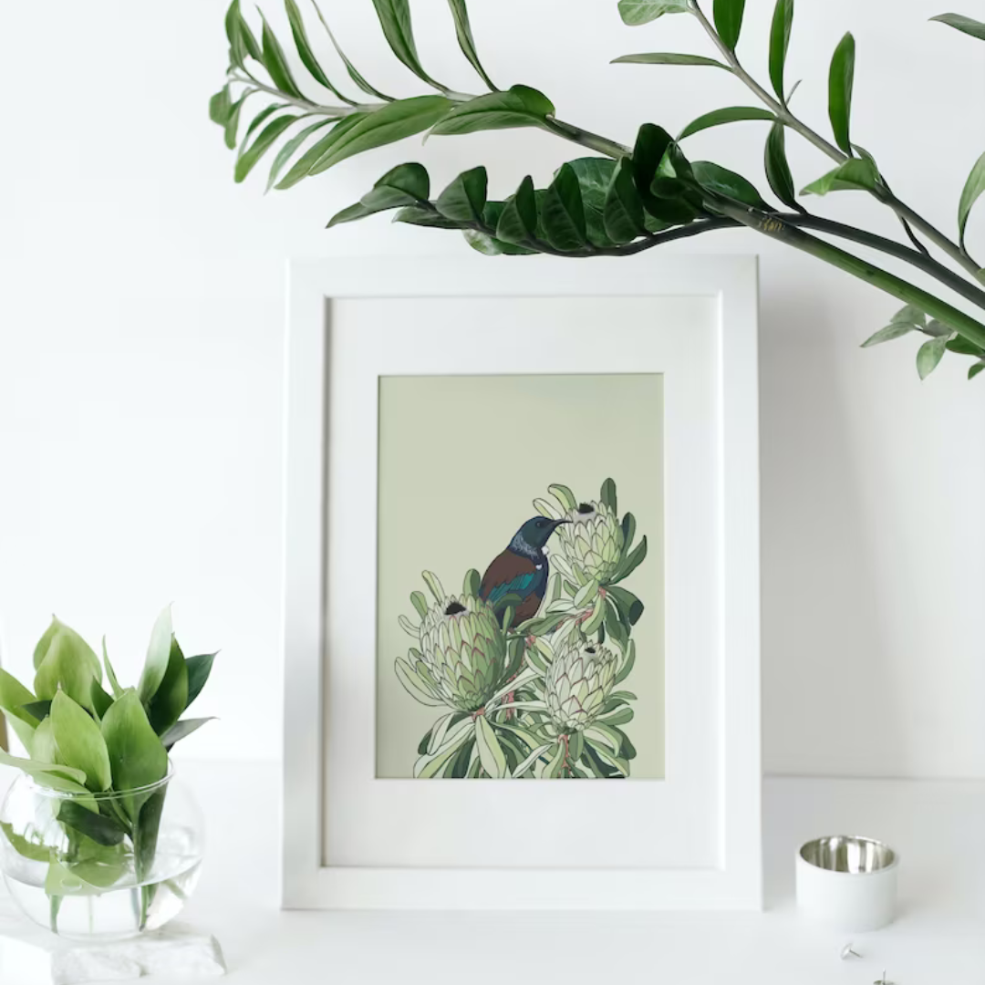 Digital art print by Bridget King featuring a Tui bird nestled amongst protea flowers.
