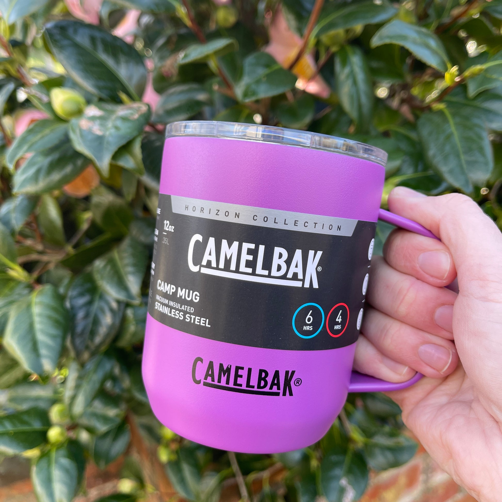 Camelbak magenta pink stainless camping mug with lid and handle.