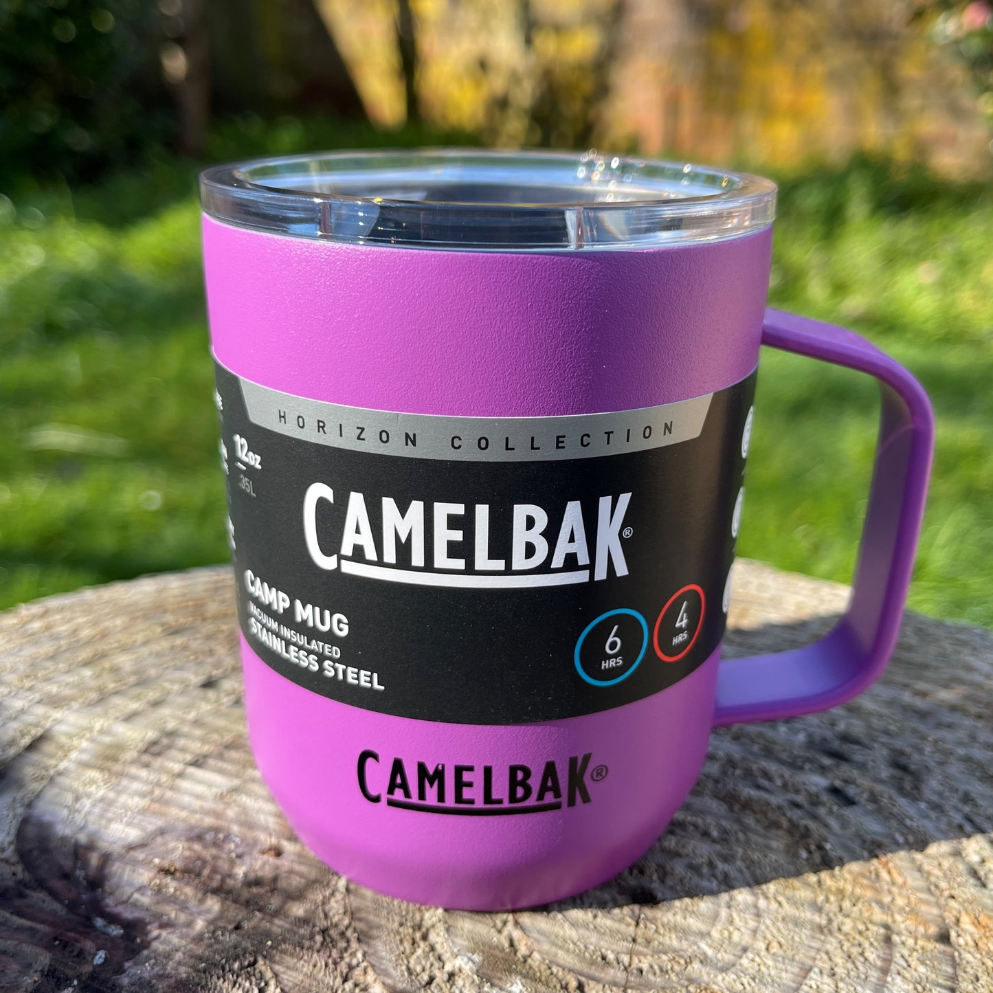 Camelbak magenta pink stainless camping mug with lid and handle.