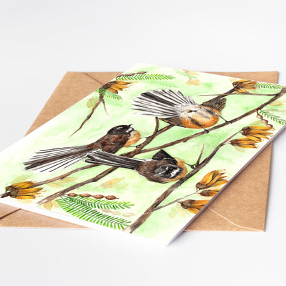 Greeting card by artist Leah Ingram featuring Fantails birds amongst Kowhai flowers.