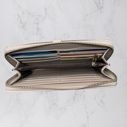 Inside of a mushroom coloured wallet by Moana Road.