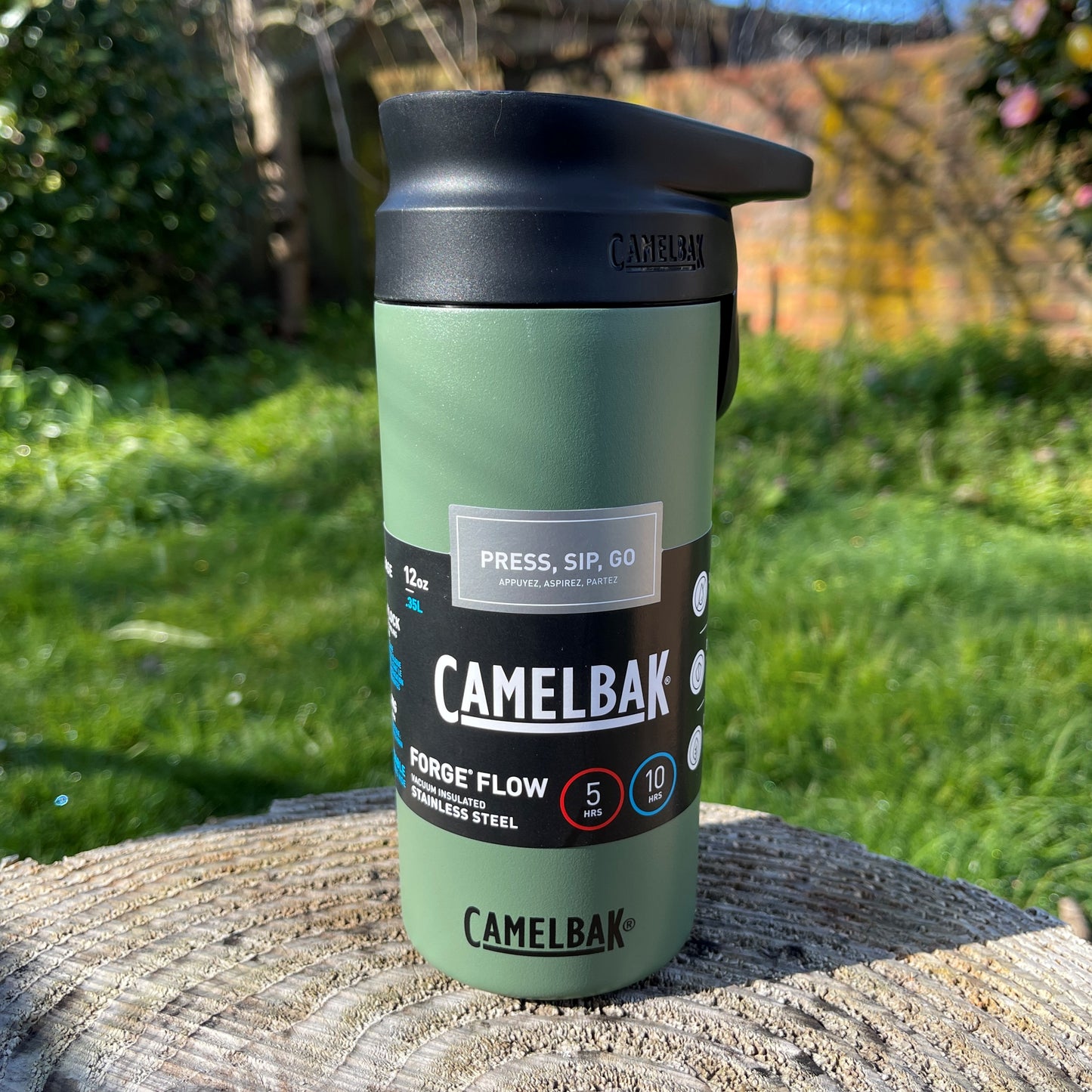 Stainless steel Camelbak insulated coffee cup with a press to sip function in moss green colour.