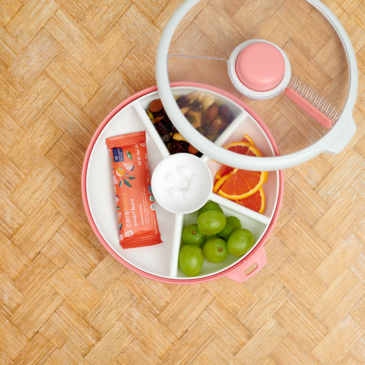 Gobe snack spinner lunch box in coral pink and white.