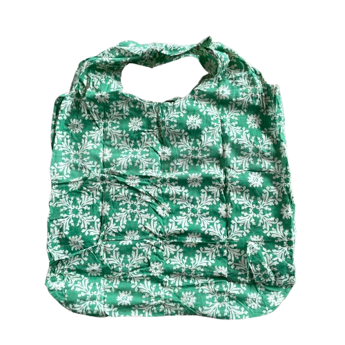 Green cotton tote bag with white floral decorative pattern.