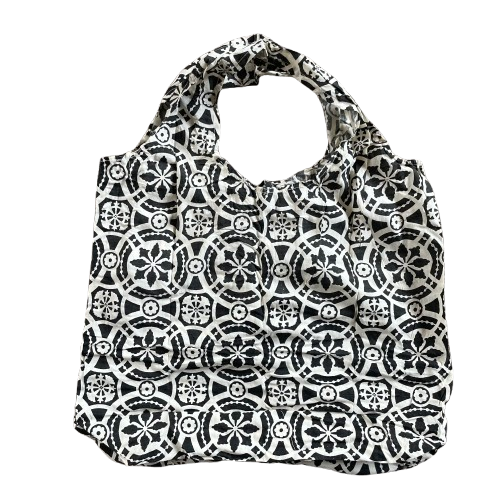 Black cotton tote bag with white floral decorative pattern.