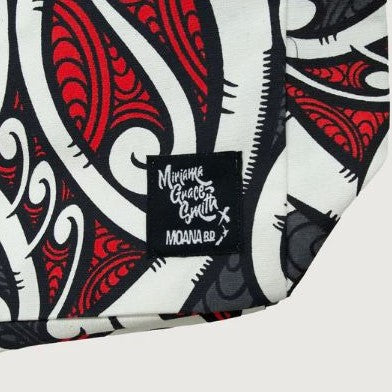 Tote bag with red, black and white maori design.