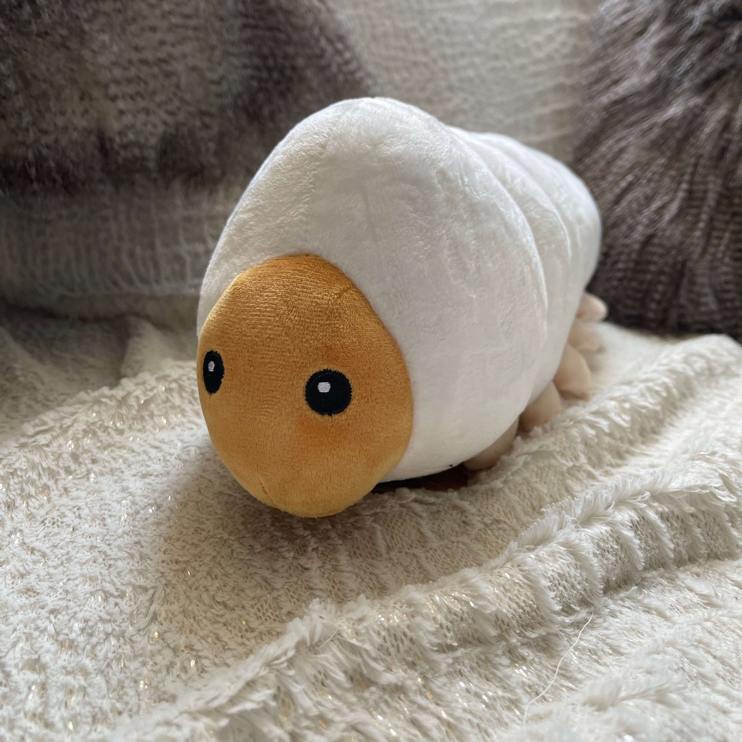 Plush soft toy in the form of a Huhu Grub.