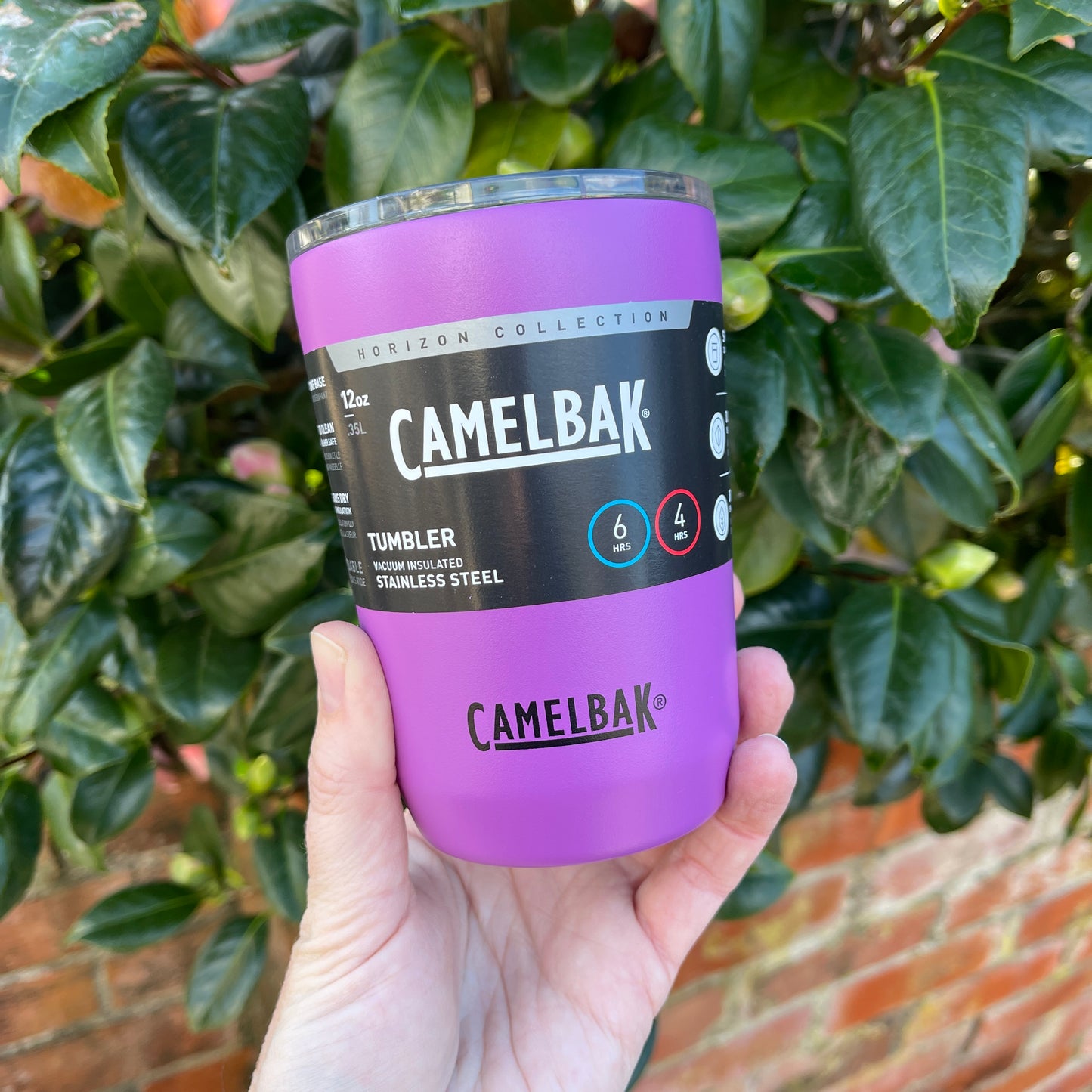 Stainless steel coffee tumbler from Camelbak in a magenta colour.