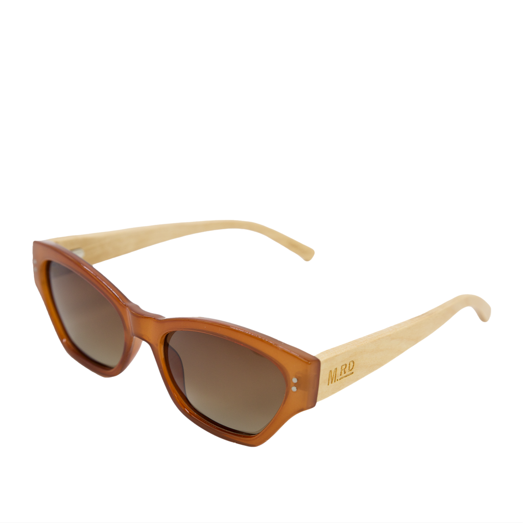 Burnt orange coloured plastic frame sunglasses with brown polarized lenses and wooden arms with the MRD logo stamped into the arm.