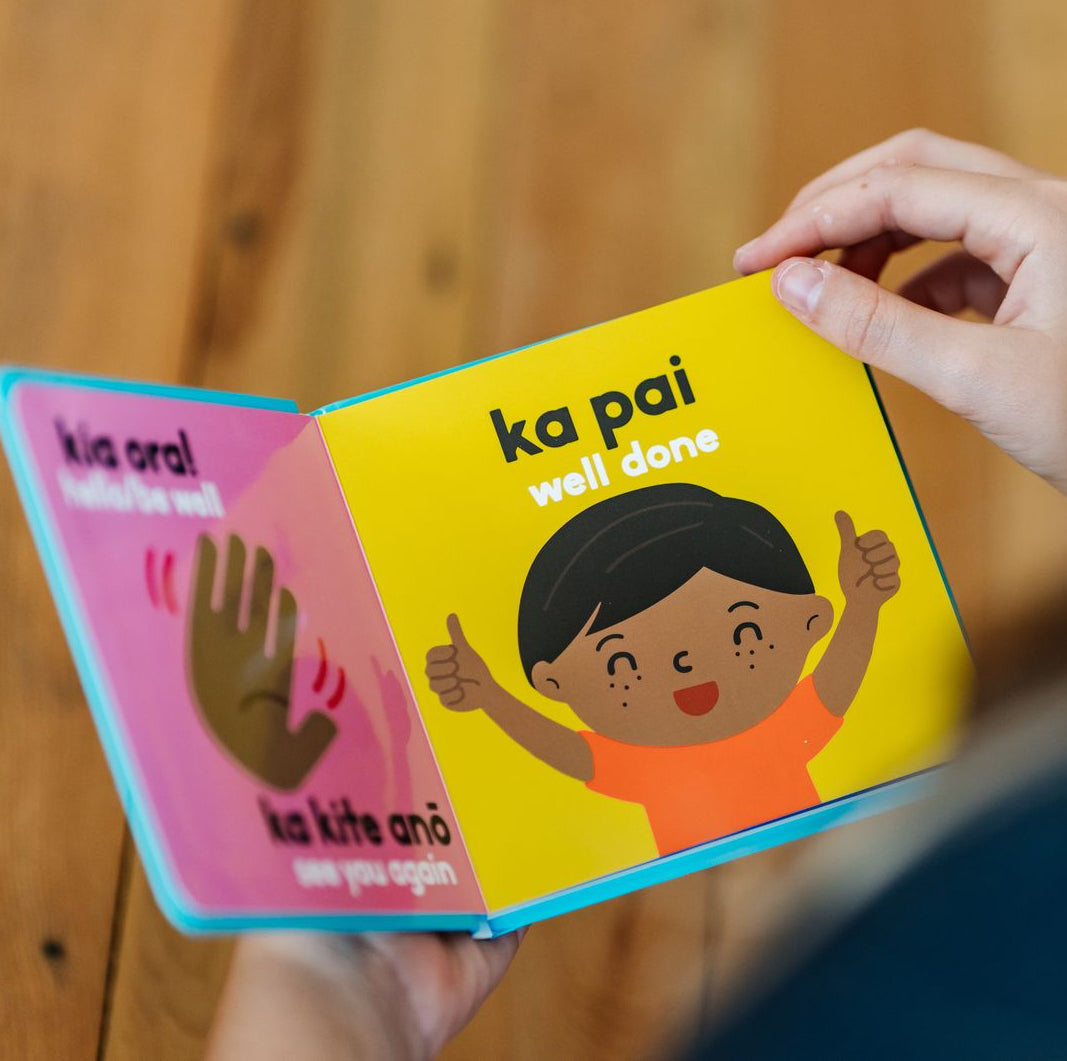 Children's book with a colorful cover featuring a child giving a thumbs up and the words Ka Pai/Well Done.