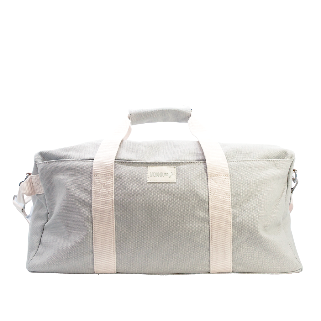 Grey duffel bag with white straps on a white background