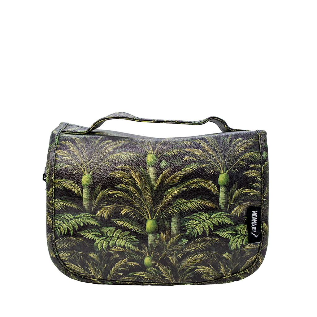 A rectangular toiletry bag with a top handle, featuring an all-over green palm tree and fruit print on a dark background. A small black brand tag on the right side reads 'MOANA RD'.