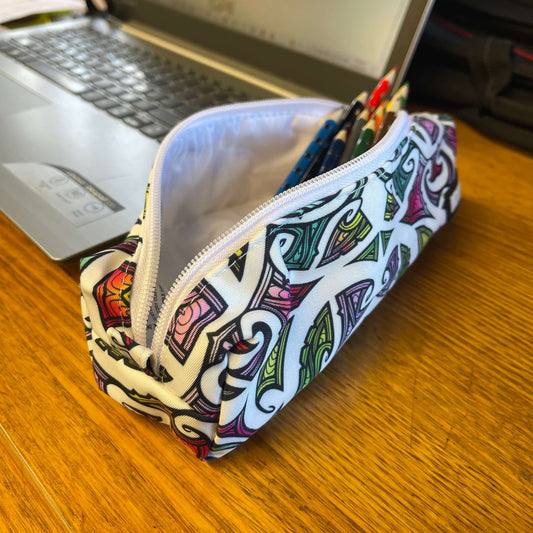 Pencil case with colourful maori design on a white background.