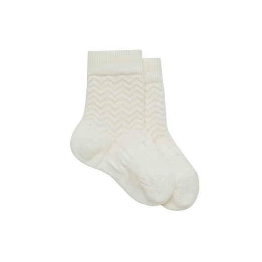 Baby merino crew socks in a pearly cream colour with raised zigzag pattern.