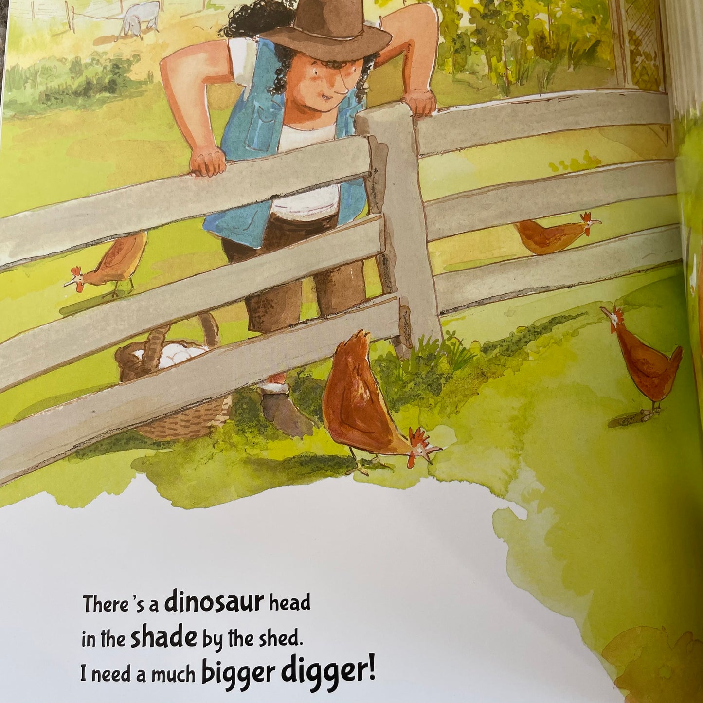 Inside pages from the book showing a picture of a farmer looking over the fence at some brown hens.