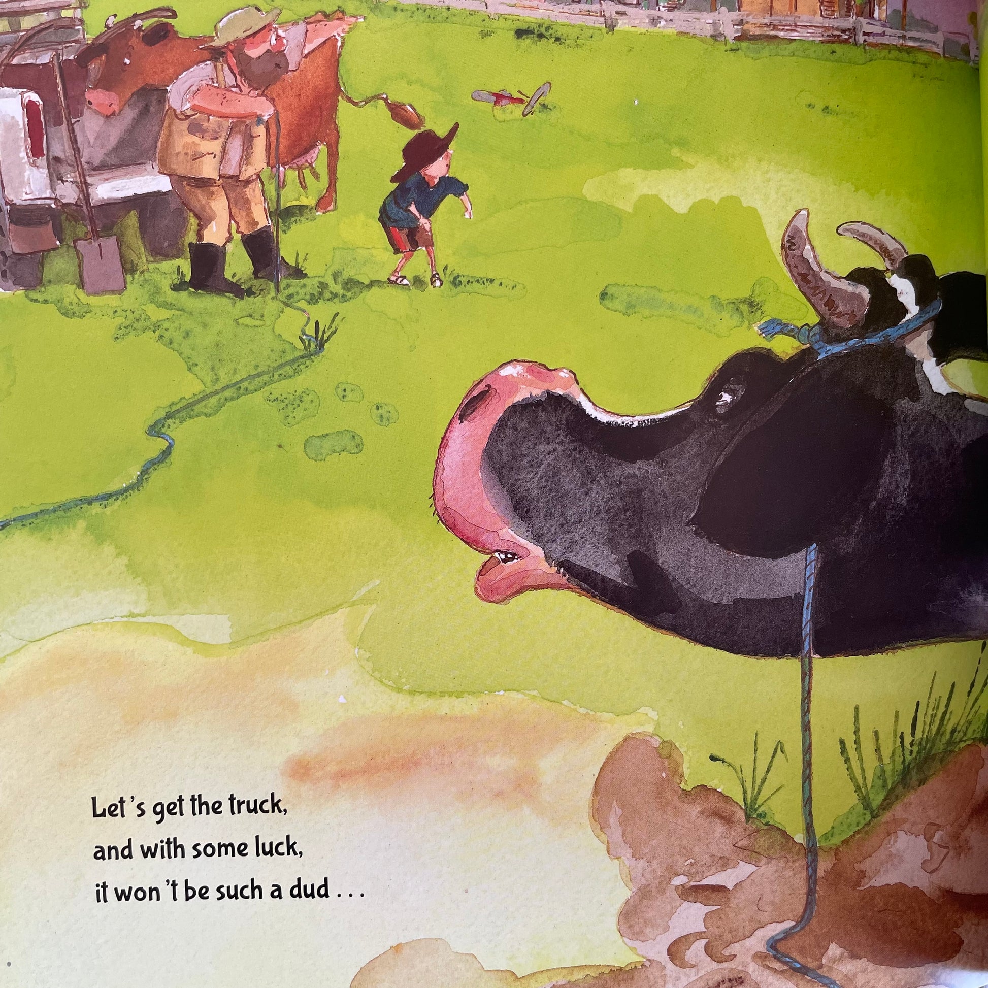 Inside pages of the book showing a cow looking at a farmer and a small child as the ponder how to get the cow out of the muck.
