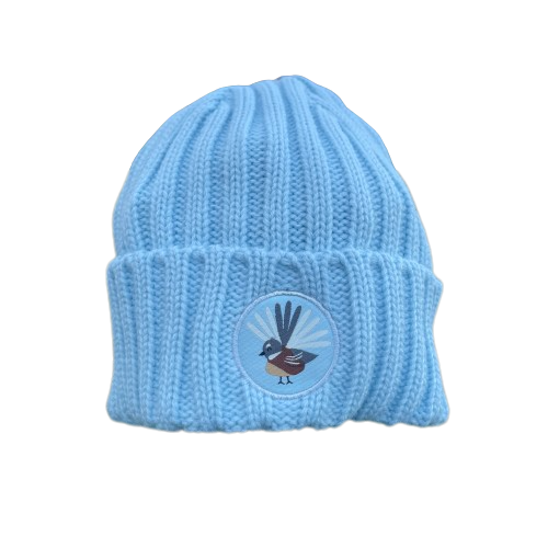 Kids blue knit beanie with fantail emblem on the front.