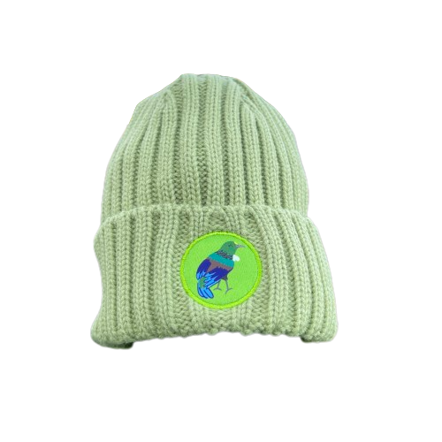 Green knit kids beanie with Tui bird emblem.
