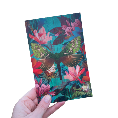 Greeting card designed by artist Flox featuring a moth and magnolia flowers in bold colours.