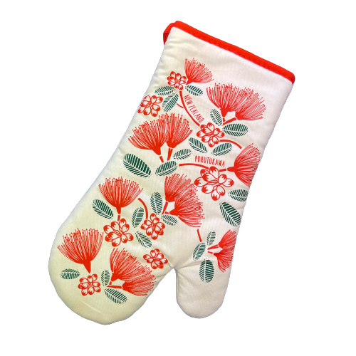 White oven mitt with red pohutukawa flowers and green leaves.