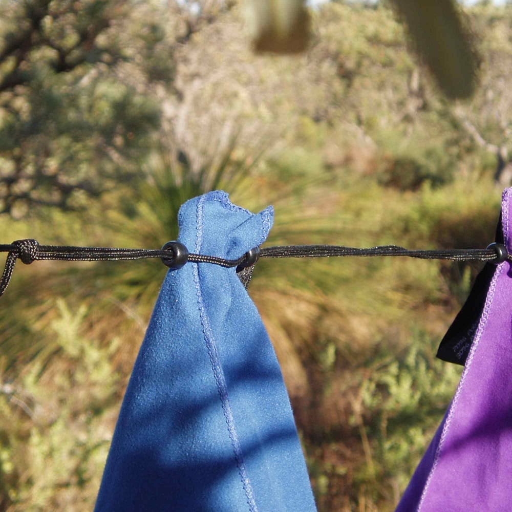 Camping clothes line with towels drying.