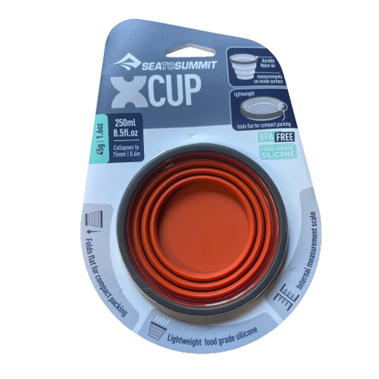 Rust orange silicone collapsible X cup by Sea to Summit.