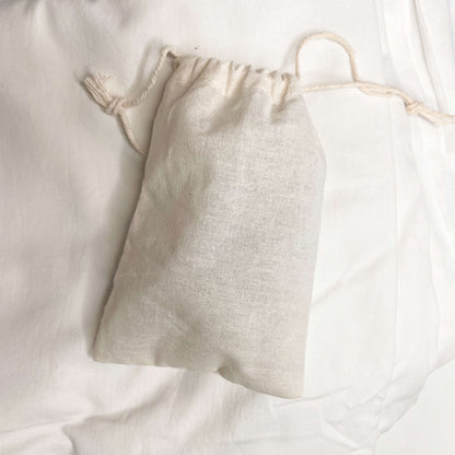 Cotton bag containing stainless pegs.