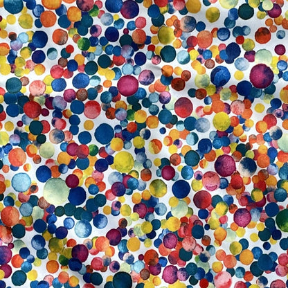 Close up of a multicoloured dotty fabric print.