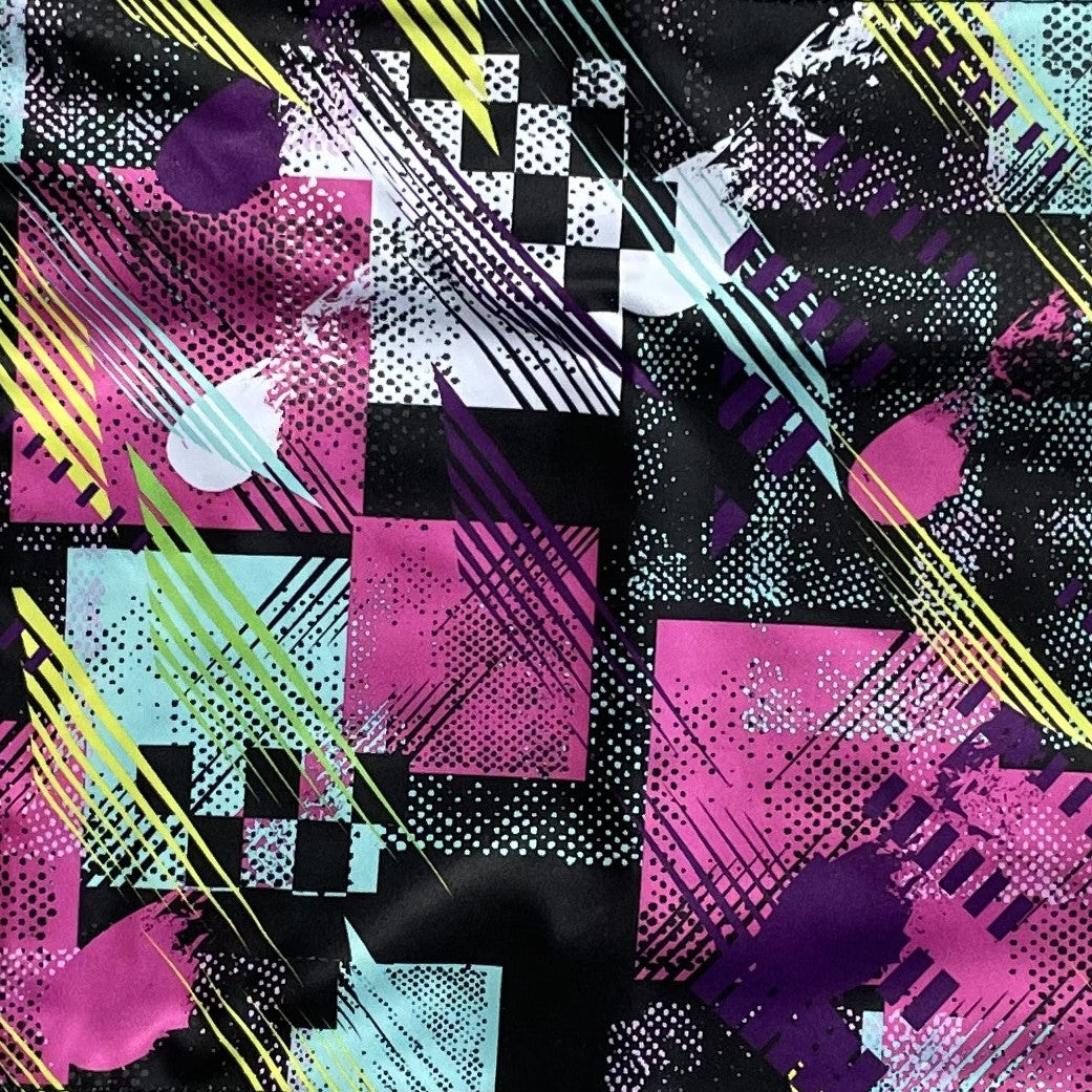 Closeup of an abstract fabric in pink and black.