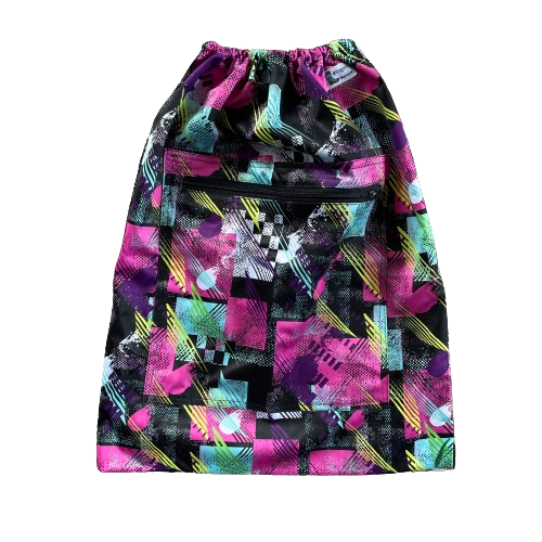 Drawstring backpack style wetbag with a zipped pocket on the front in a pink and black abstract pattern.