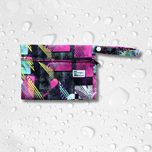 Small wet bag in a pink and black abstract print.