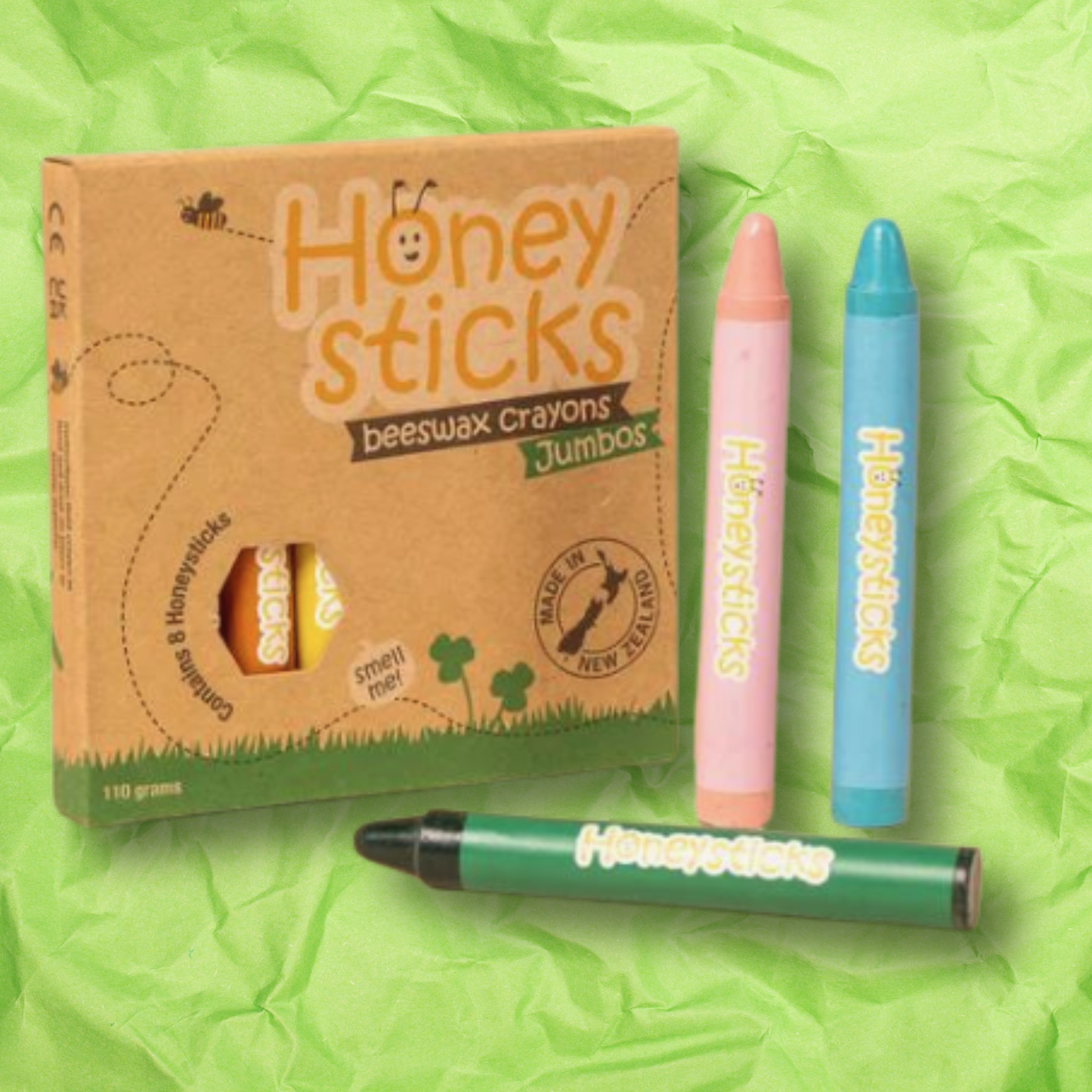 Honeysticks Jumbo crayons box with crumpled green paper background