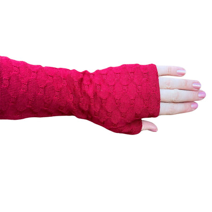 Fingerless merino gloves in red textured knit.