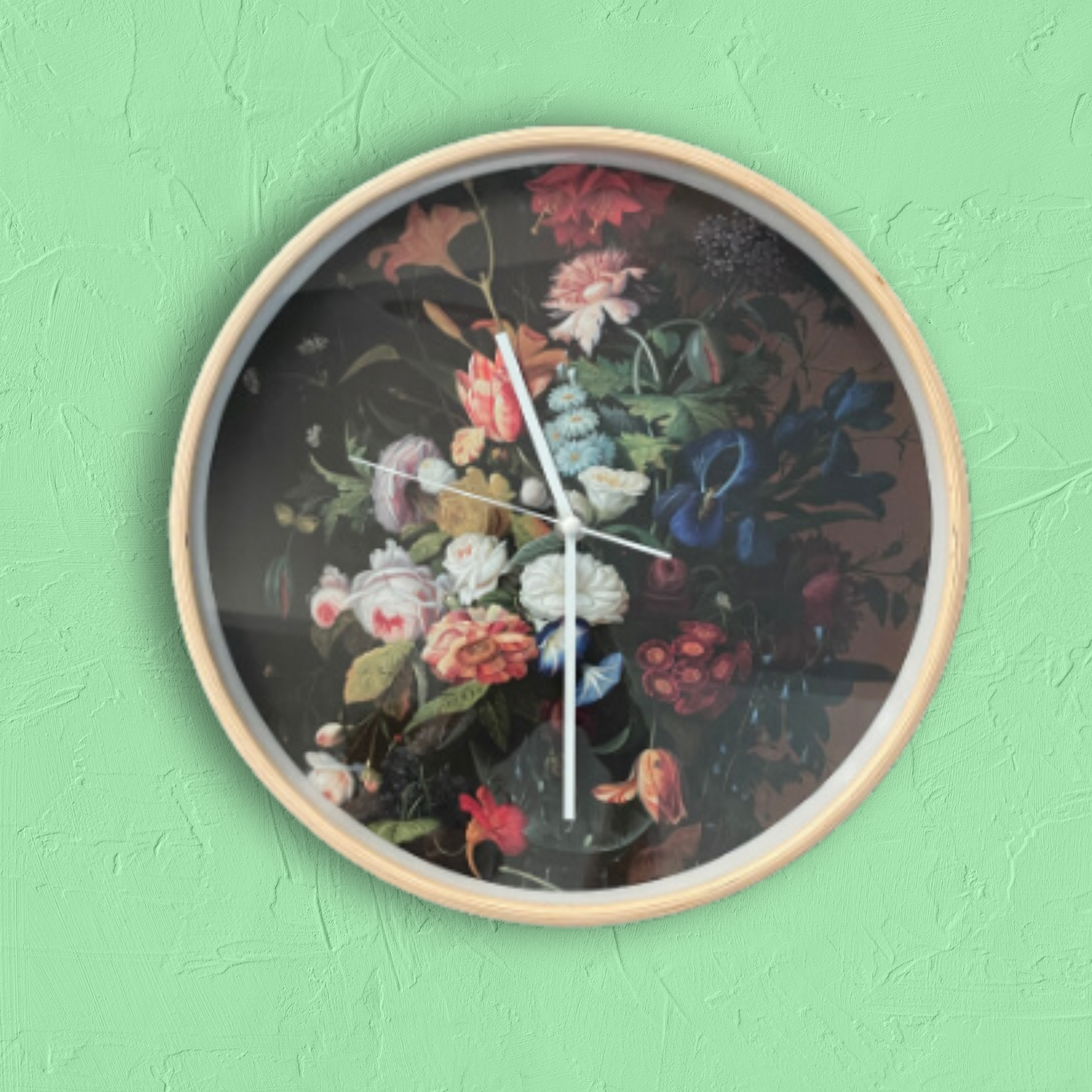 Wooden framed clock with dark floral picture on the face.