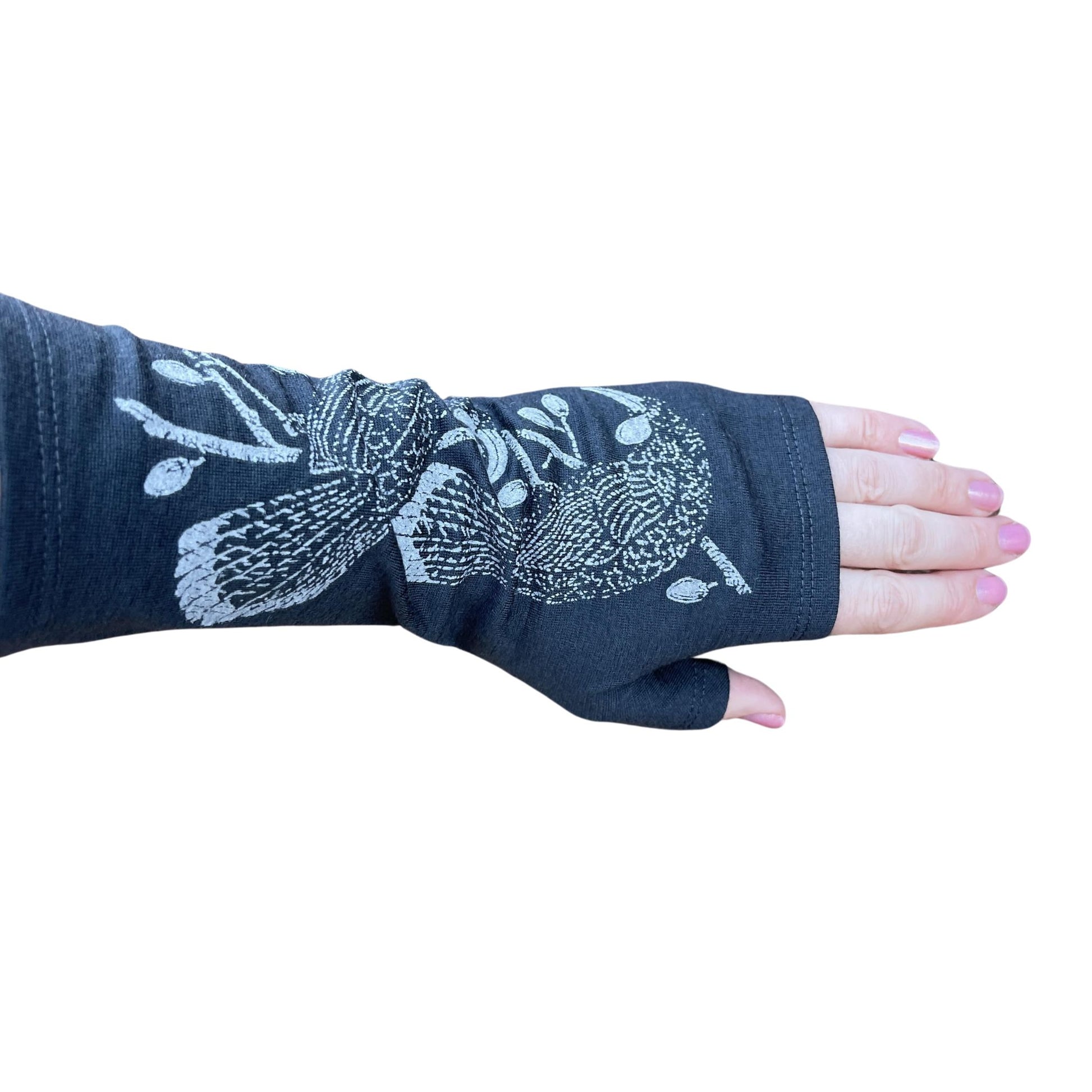 Fingerless merino gloves in charcoal with grey Huia bird print.