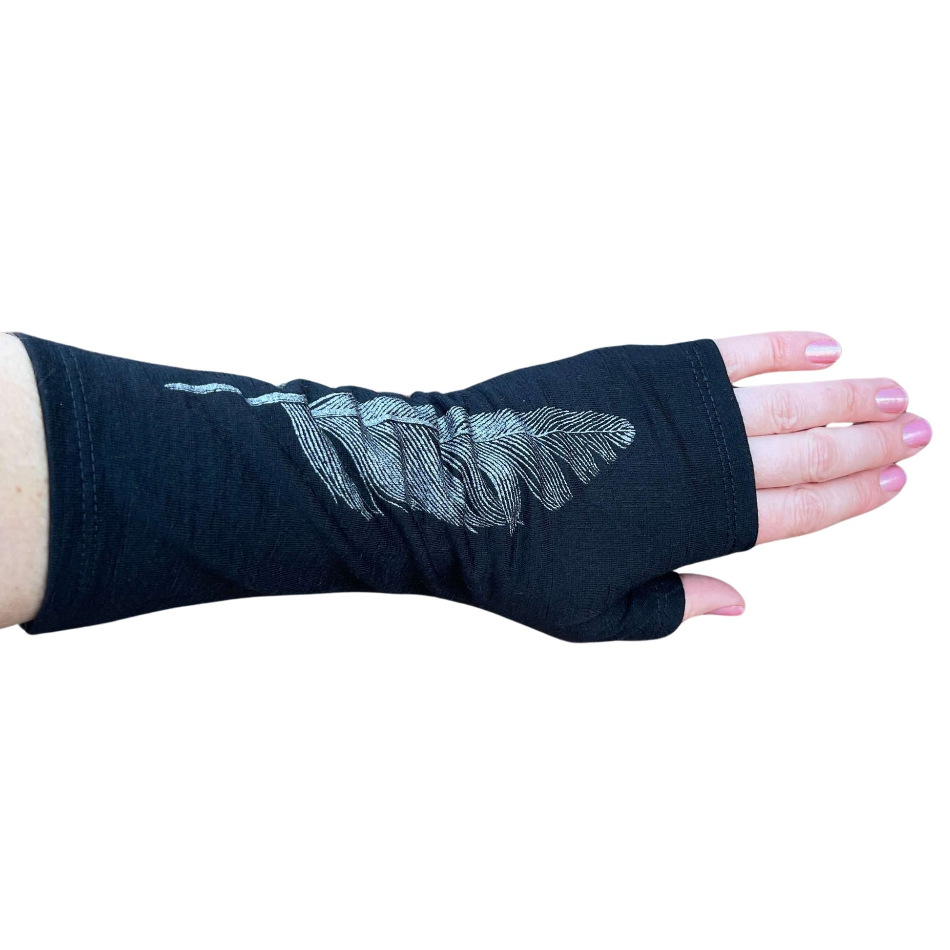 Fingerless merino gloves in black with silver feather print.