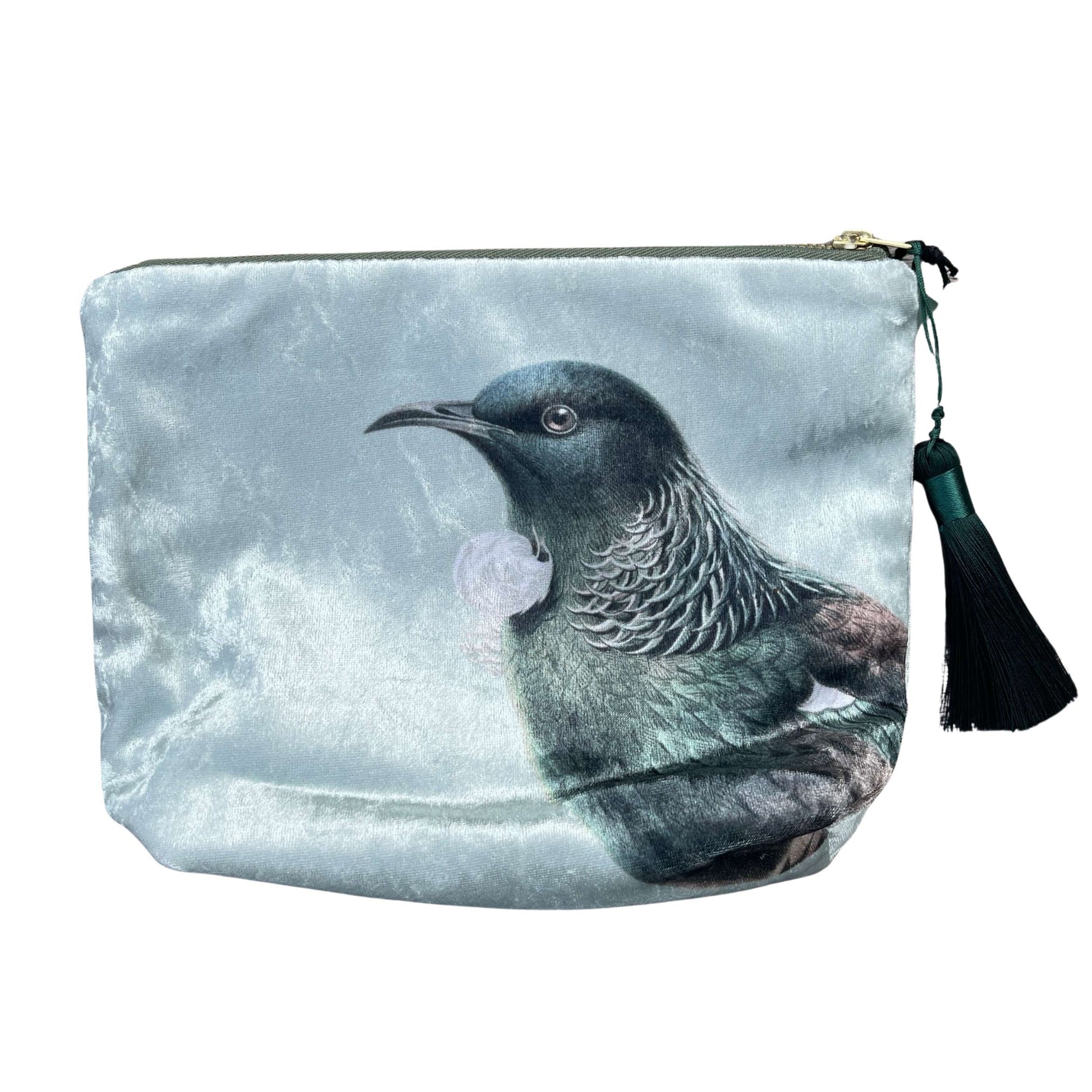 Velvet cosmetic bag featuring the head of a Tui bird.
