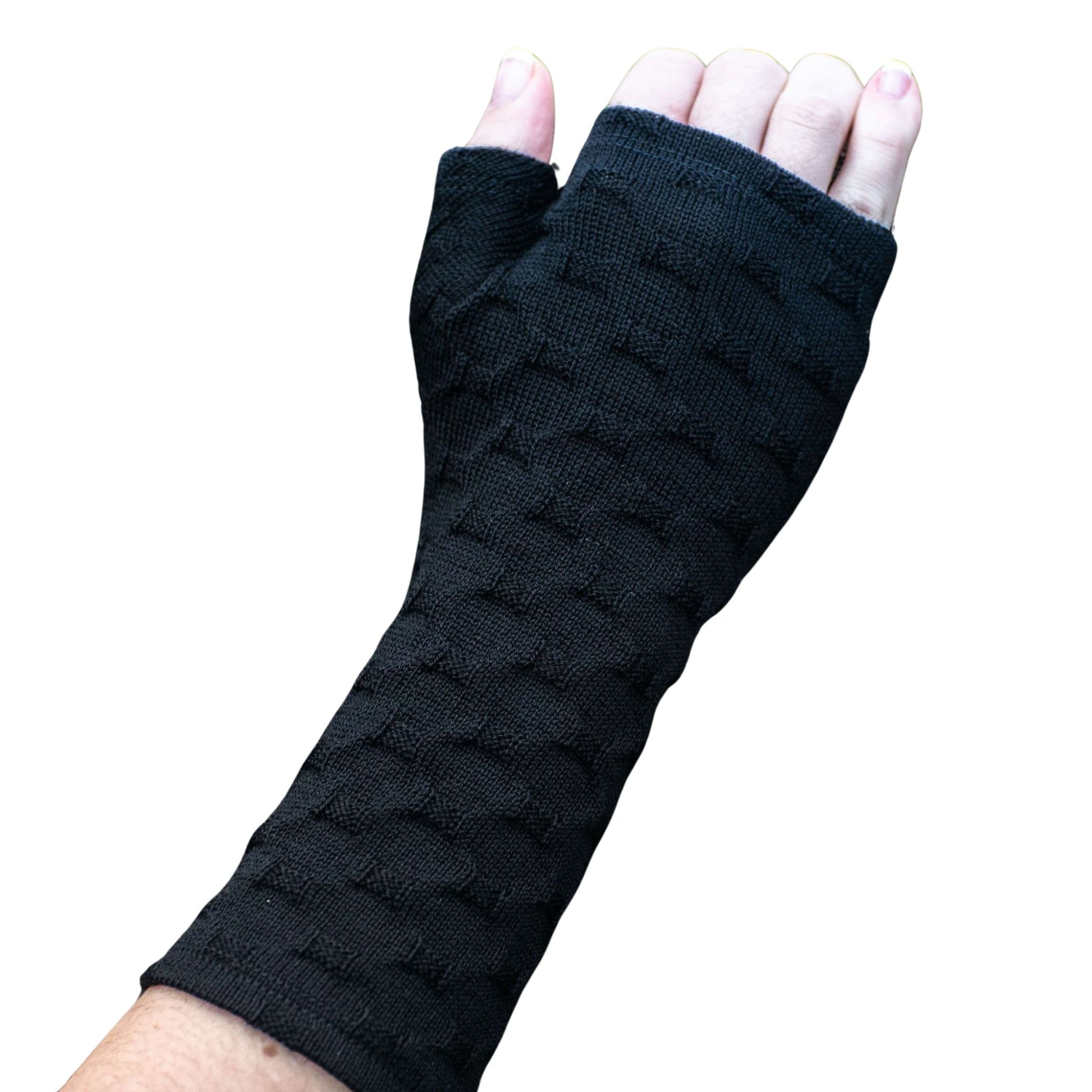 Fingerless merino gloves in textured black knit.